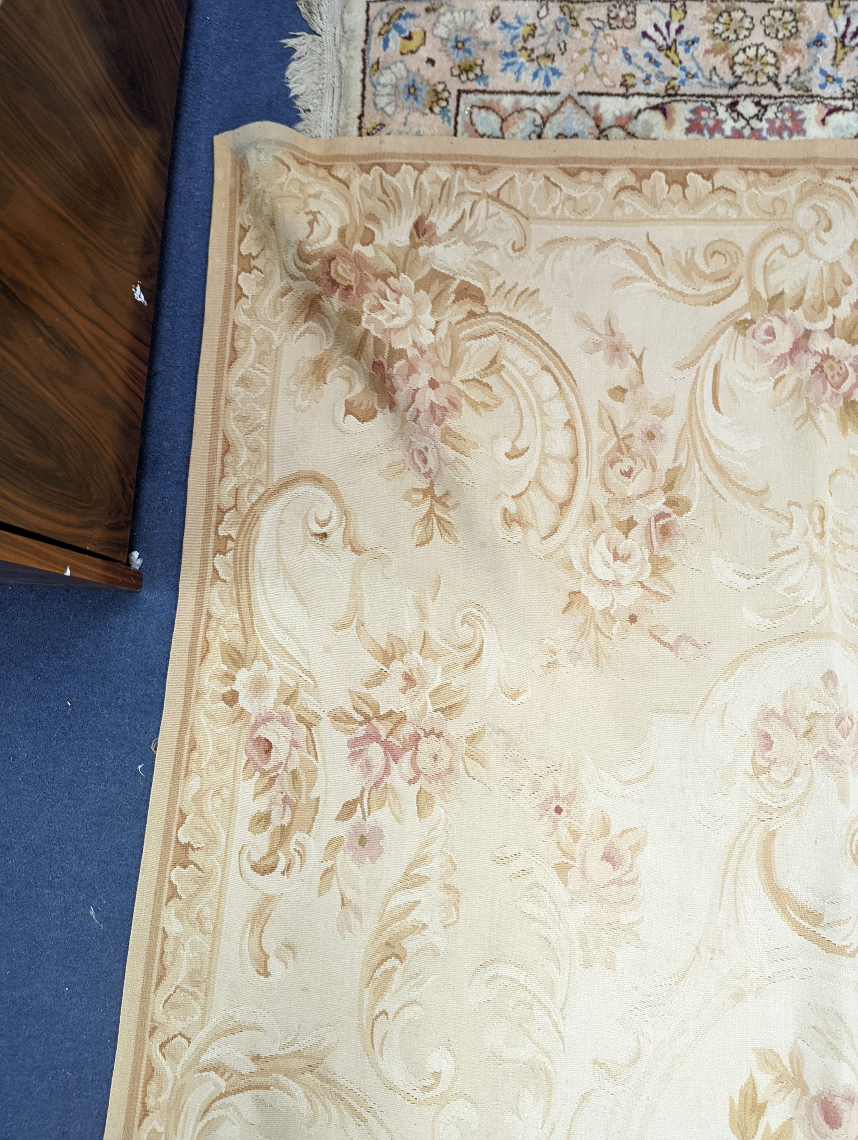An Aubusson gold ground rug with rose pattern, 244 x 153cm